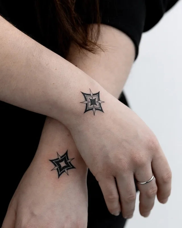 matching blackwork geometric square tattoo on woman wrists