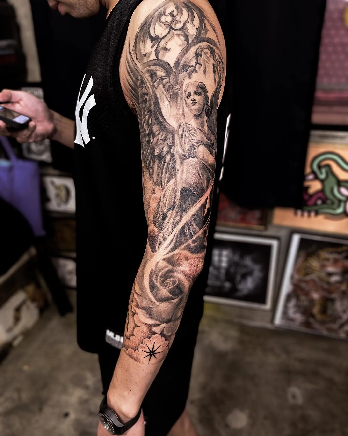 black and grey arm full sleeve angel tattoo
