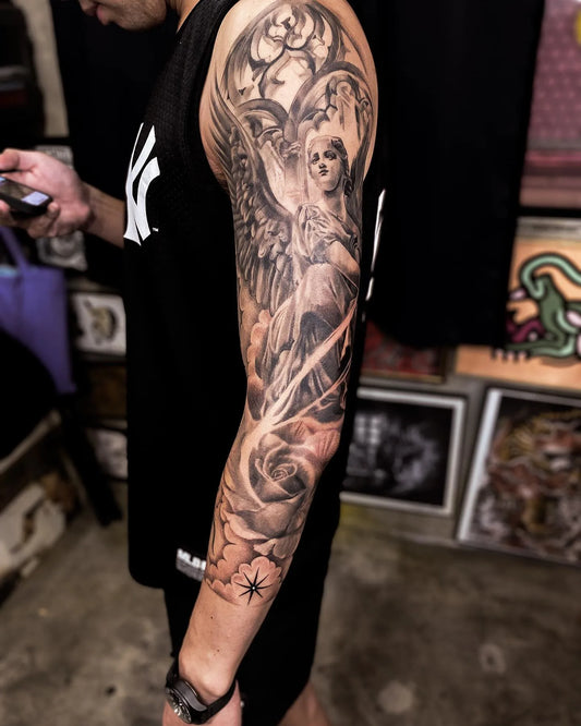 black and grey arm full sleeve angel tattoo