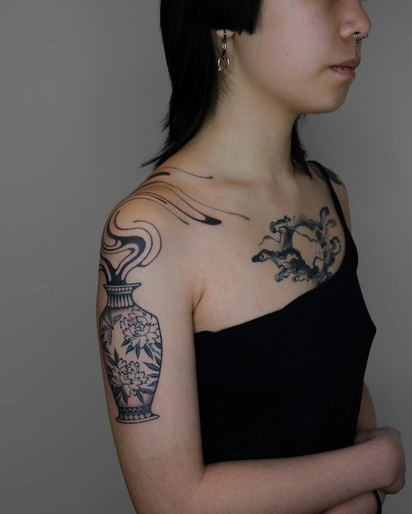 abstract vase blackwork woman shoulder tattoo