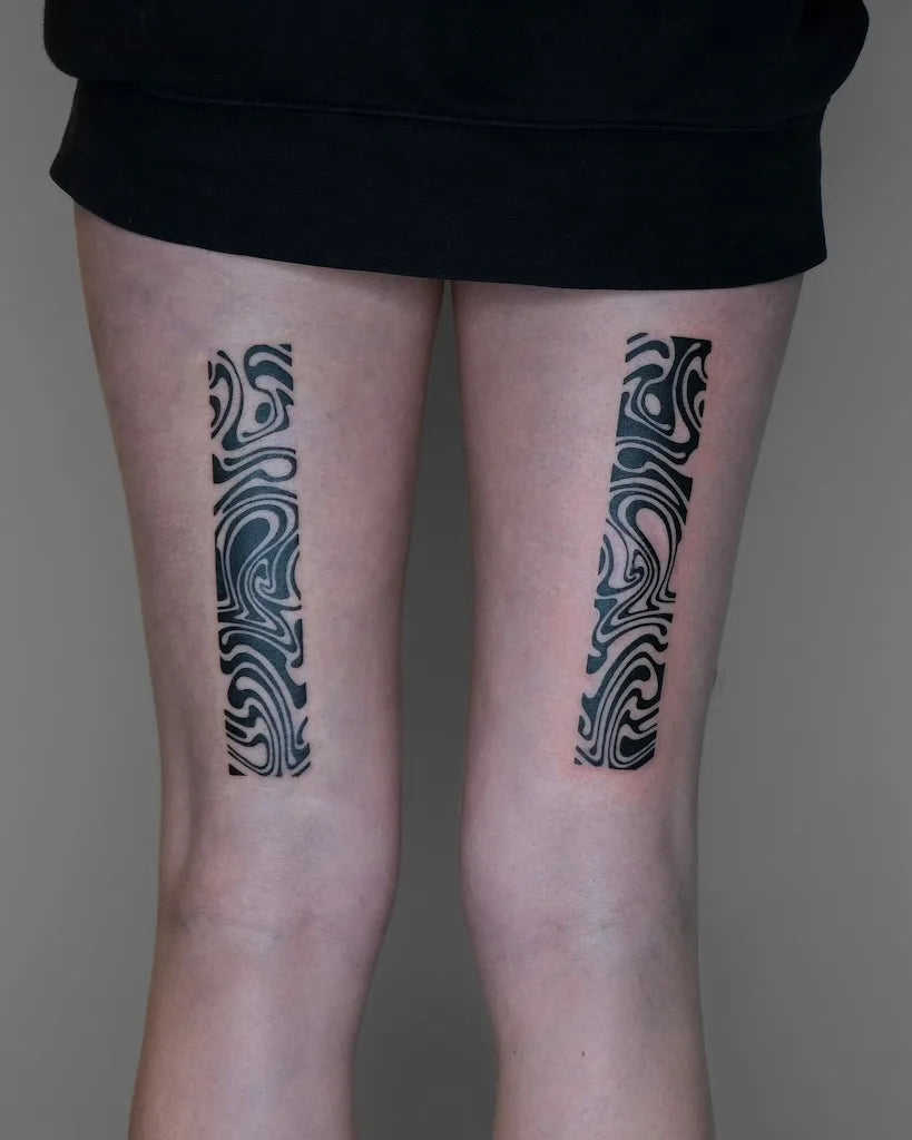 abstract blackwork pattern woman thigh tattoo