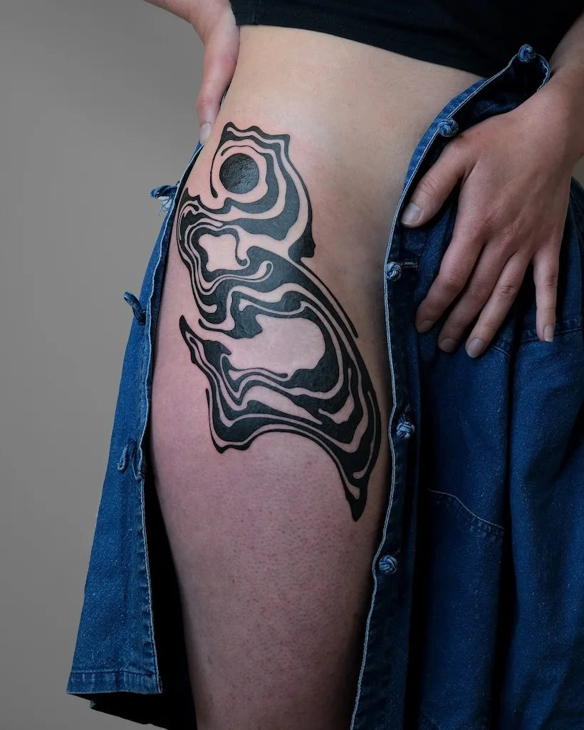 abstract blackwork pattern woman side hip tattoo