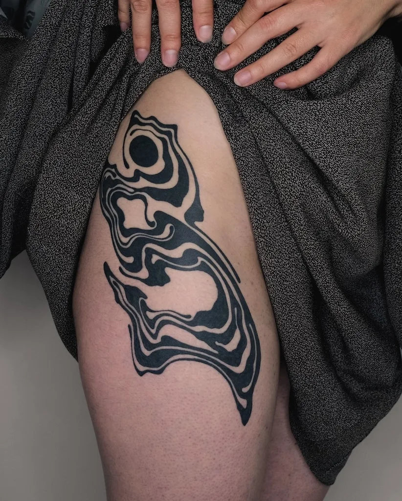 abstract blackwork pattern thigh hip tattoo