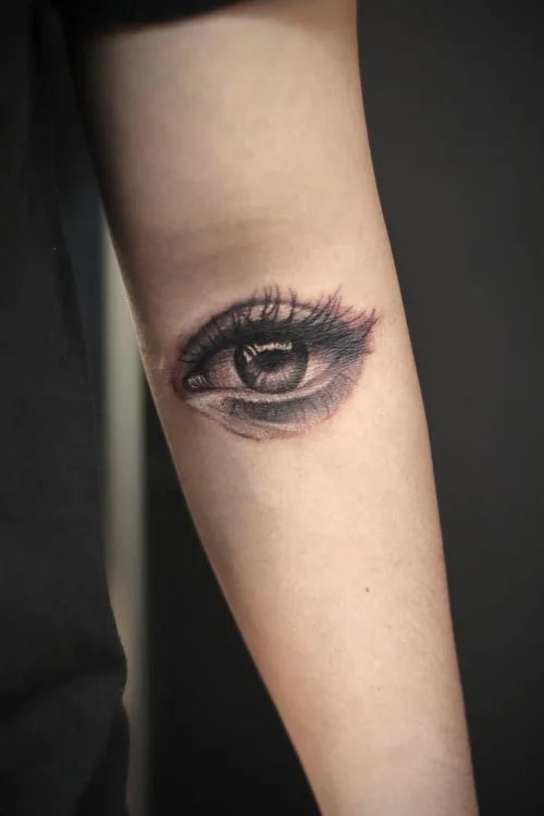 realistic eye tattoo on arm