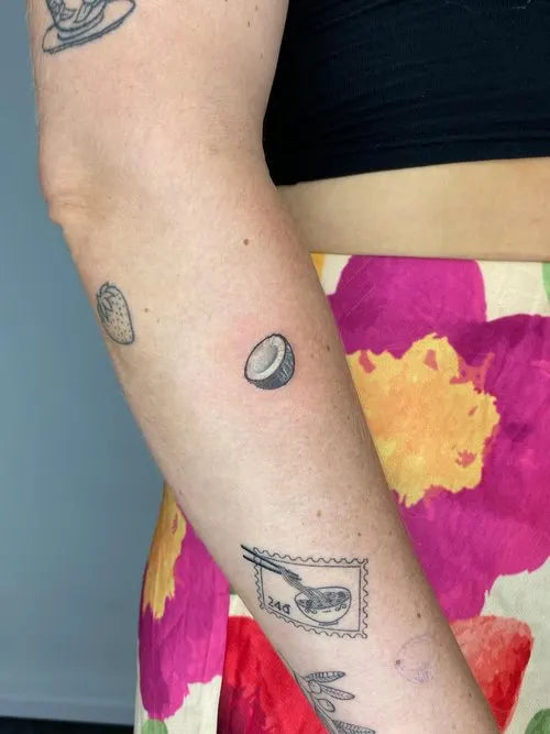small realistic minimalist coconut tattoo
