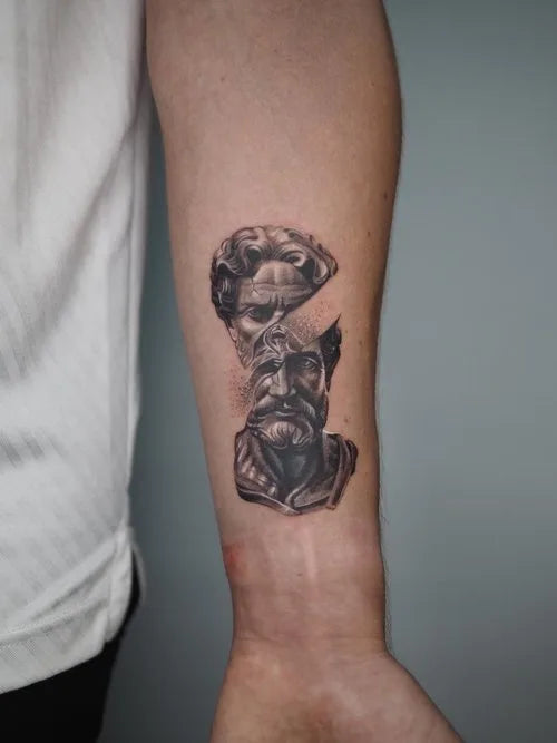 black and grey realistic greek statue two busts inner arm tattoo