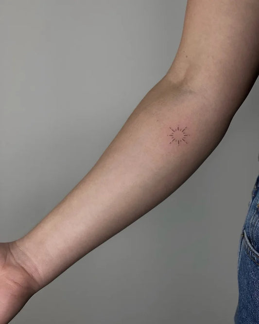 minimalist sun tattoo