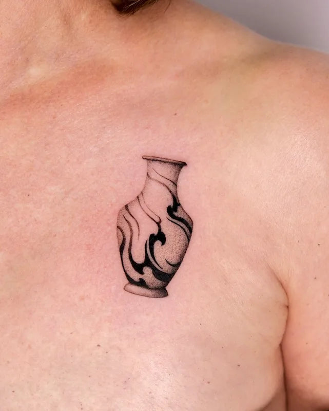 dotwork flower vase tattoo on chest