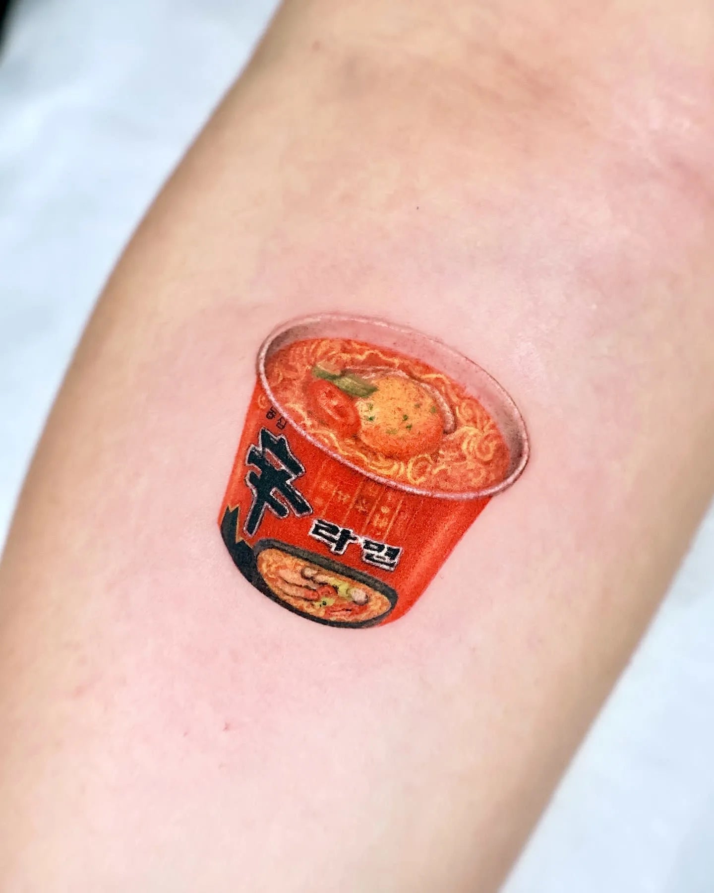 realistic cute korean spicy noodle tattoo