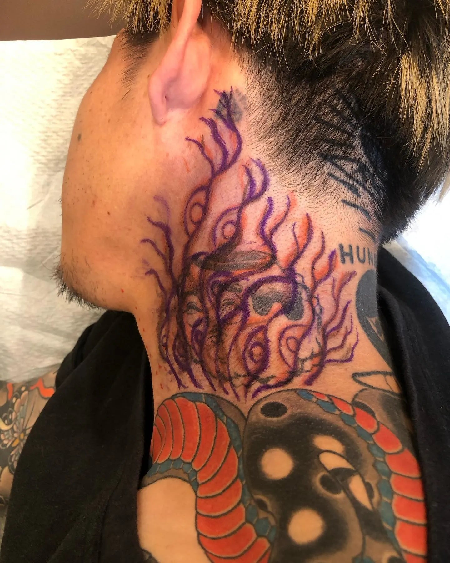 japanese cover up abstract fire tattoo on man neck