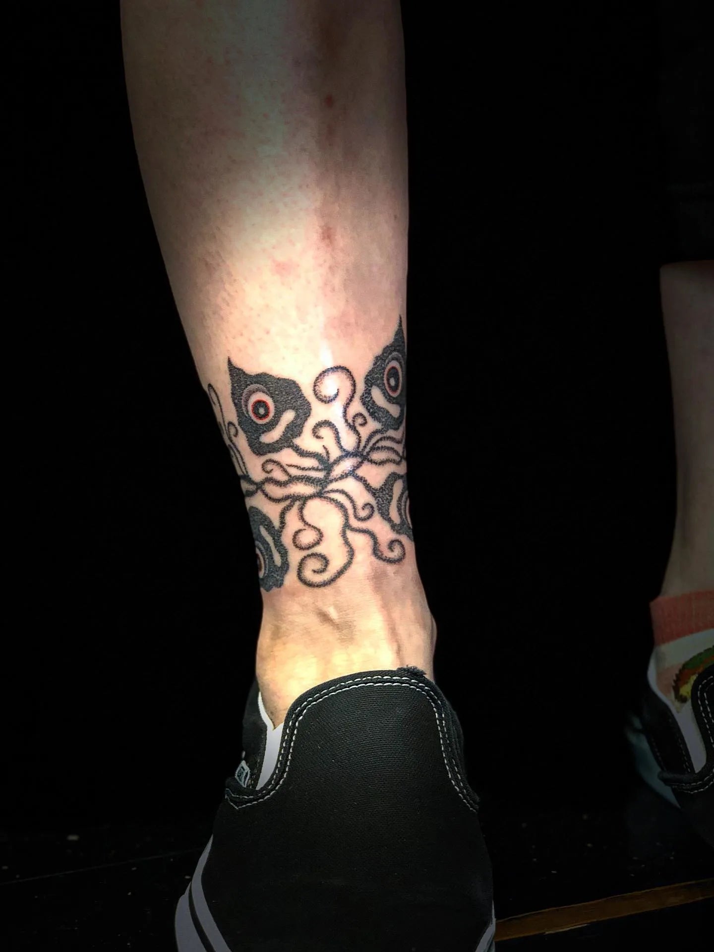 japanese dotwork one eye ghosts tattoo on ankle