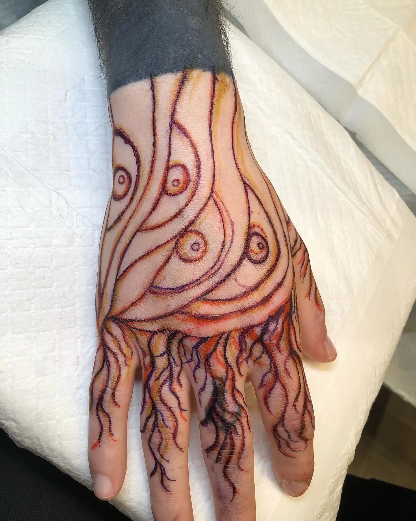 japanese fire abstract lines tattoo on hand