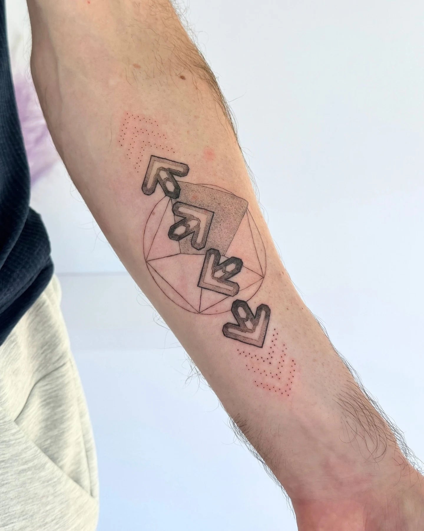 arrows man forearm tattoo
